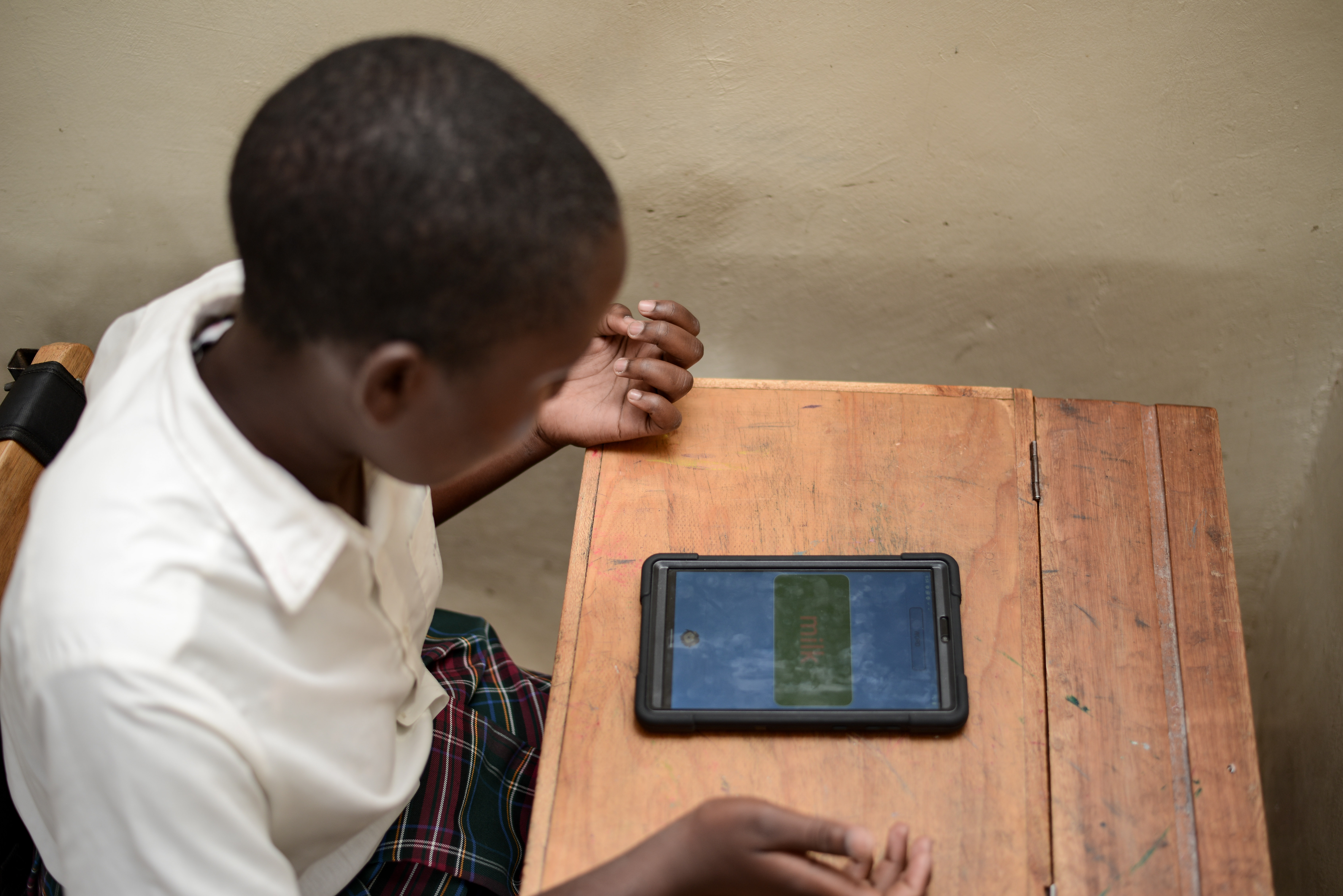Child writing on floor